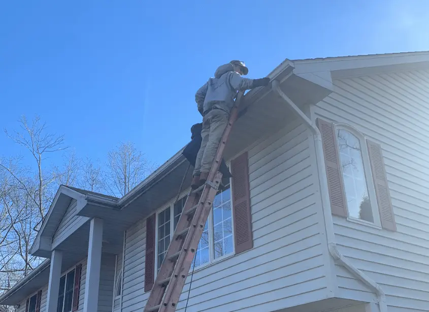 Gutter cleaning and maintenance being performed by Parma Heights Power Washing in Parma Heights